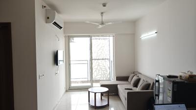 Living Room Image of 975 Sq.ft 2 BHK Apartment / Flat for rent in Godrej The Suites, Jaypee Greens Greater Noida for Rs. 38000