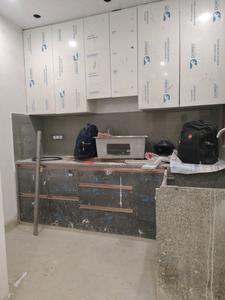 Kitchen Image of 1000 Sq.ft 2 BHK Builder Floor for rent in Murari Sharma, Rajpur Khurd Village New Delhi for Rs. 23000