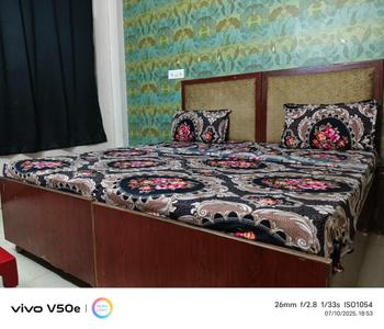 Bedroom Image of Sumit Coliving PG in Sector 52, Noida