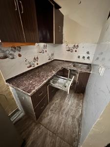 Kitchen Image of 300 Sq.ft 1 BHK Independent House for rent in  Rohini Apartments RWA, Sector 8 Rohini New Delhi for Rs. 11000
