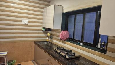 Kitchen Image of 550 Sq.ft 1 BHK Apartment / Flat for rent in Arihant Aarohi, Shilgaon Thane for Rs. 20000