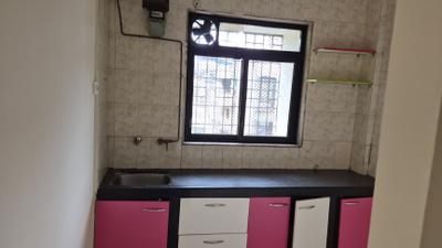Kitchen Image of 950 Sq.ft 2 BHK Apartment / Flat for rent in Shashwat Athashree, Kopar Khairane Navi Mumbai for Rs. 42000