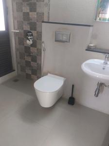 Common Bathroom Image of 850 Sq.ft 2 BHK Apartment / Flat for sale in Mahindra Roots, Kandivali East Mumbai for Rs. 17500000