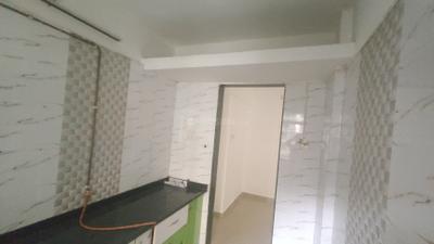 Kitchen Image of 960 Sq.ft 2 BHK Apartment / Flat for rent in Mohan Willows I, Badlapur East Badlapur for Rs. 13000