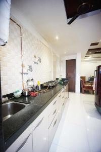 Kitchen Image of 884 Sq.ft 2 BHK Apartment / Flat for sale in Moshi Pune for Rs. 5500000