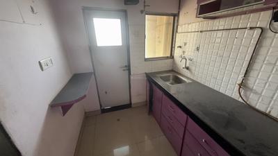 Kitchen Image of 600 Sq.ft 1 BHK Apartment / Flat for sale in Sukur Enclave A, Kasarvadavali Thane for Rs. 6000000