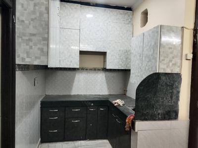 Kitchen Image of 650 Sq.ft 1 BHK Builder Floor for rent in Dwarka Mor New Delhi for Rs. 11500