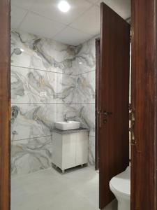 Common Bathroom Image of 1095 Sq.ft 2 BHK Apartment / Flat for sale in Devla Greater Noida for Rs. 3755444