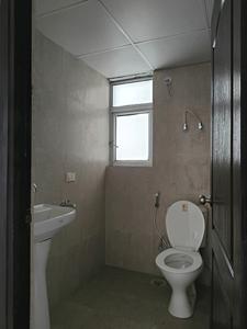 Common Bathroom Image of 585 Sq.ft 1 BHK Apartment / Flat for sale in Aditya Urban Homes, Bamheta Village Ghaziabad for Rs. 3175000