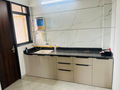 Kitchen Image of 760 Sq.ft 2 BHK Apartment / Flat for rent in Pramukh Praise, Sargasan Gandhinagar for Rs. 23000