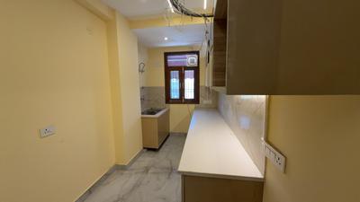 Kitchen Image of 1350 Sq.ft 3 BHK Builder Floor for sale in Bhatti Kalan New Delhi for Rs. 7000000