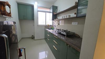 Kitchen Image of 650 Sq.ft 1 BHK Apartment / Flat for sale in Puraniks City Reserva Phase 1, Kasarvadavali Thane for Rs. 6300000