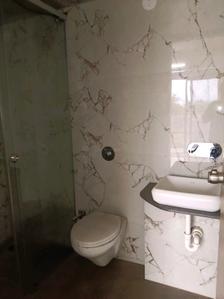 Common Bathroom Image of 1250 Sq.ft 2 BHK Apartment / Flat for sale in K Raheja T8 Luxuriant Phase 2, Mohammed Wadi Pune for Rs. 9500000