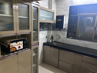 Kitchen Image of 1050 Sq.ft 1 BHK Apartment / Flat for rent in Rekhi Sai Daffodils, Kharghar Navi Mumbai for Rs. 44000