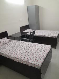 Bedroom Image of Adya pg in Sector 19, Noida