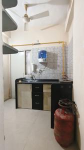 Kitchen Image of 788 Sq.ft 1 BHK Apartment / Flat for rent in Poddar Palm Greens, Makarba Ahmedabad for Rs. 22000