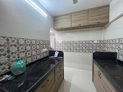 Kitchen Image of Anandi Apartment in Goregaon West, Mumbai
