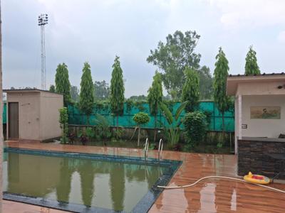 Swimming Pool Image of 9072 Sq.ft 3 BHK Farm House for sale in Dkrrish Green Beauty Farms, Sector 135 Noida for Rs. 13000000