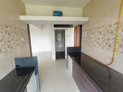 Kitchen Image of 700 Sq.ft 1 BHK Apartment / Flat for sale in Thakurli Thane for Rs. 4600000
