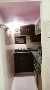 Kitchen Image of 450 Sq.ft 1 BHK Builder Floor for rent in Dwarka Mor New Delhi for Rs. 11000