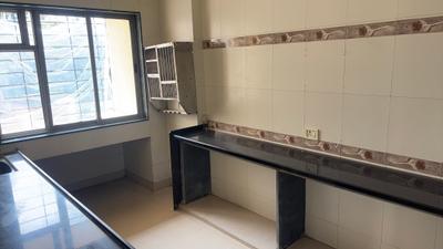 Kitchen Image of 700 Sq.ft 1 BHK Apartment / Flat for sale in Oshodhara Greens, Kalyan West Kalyan for Rs. 4071000