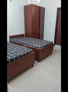 Bedroom Image of Apna Niwas pg  in Sector 62, Noida