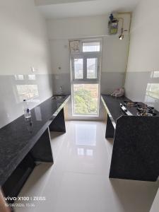 Kitchen Image of 900 Sq.ft 2 BHK Apartment / Flat for rent in Ashar Arize, Kalwa Thane for Rs. 40000