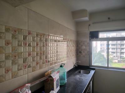 Kitchen Image of 750 Sq.ft 1 BHK Apartment / Flat for rent in Paradigm Pushpanjali Residency Phase III, Kasarvadavali Thane for Rs. 16522