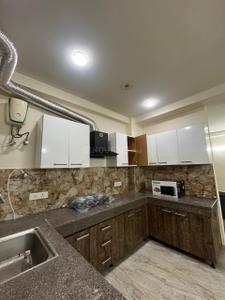 Kitchen Image of 1150 Sq.ft 2 BHK Builder Floor for rent in Sector 52A Gurgaon for Rs. 65000