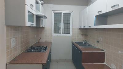 Kitchen Image of 1250 Sq.ft 2 BHK Apartment / Flat for rent in Mahagun Moderne, Sector 78 Noida for Rs. 36000