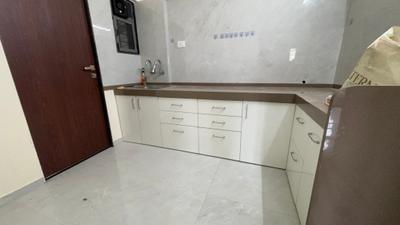 Kitchen Image of 900 Sq.ft 2 BHK Apartment / Flat for rent in Ten United Athashri, Lohegaon Pune for Rs. 21000