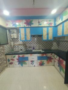 Kitchen Image of 890 Sq.ft 1 BHK Apartment / Flat for rent in Shree Krishna Shree Mangal Murty Apartment, Chala Vapi for Rs. 8500