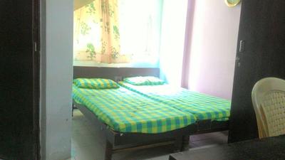 Bedroom Image of Tulja PG Room in Thaltej, Ahmedabad