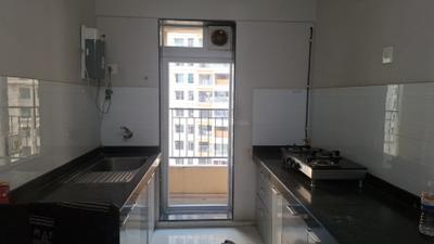 Kitchen Image of 903 Sq.ft 2 BHK Apartment / Flat for sale in Rustomjee Azziano, Thane West Thane for Rs. 13000000