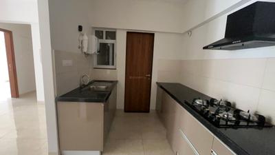 Kitchen Image of 910 Sq.ft 2 BHK Apartment / Flat for rent in Gera World Of Joy, Upper Kharadi Pune for Rs. 40000