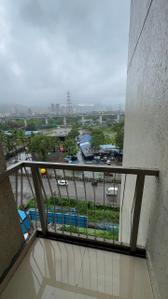 Balcony Image of 900 Sq.ft 2 BHK Apartment / Flat for rent in Palm Vista A1 &amp; A2, Shilphata Thane for Rs. 22000