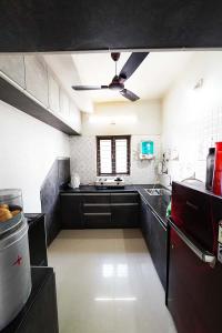 Kitchen Image of 1305 Sq.ft 3 BHK Independent House for sale in Aaditya Pimpan 101 Green Homes, Pipan Ahmedabad for Rs. 9950000