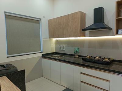 Kitchen Image of 975 Sq.ft 2 BHK Apartment / Flat for sale in Kosmic Kourtyard Phase 2, Wagholi Pune for Rs. 6900000