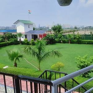 Balcony Image of 9072 Sq.ft 3 BHK Independent House for sale in Dkrrish Green Beauty Farms, Nagli Sabapur Noida for Rs. 12500000