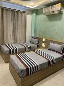 Bedroom Image of ROOMSOOM PG in Sector 16, Noida