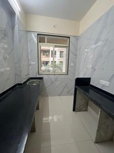 Kitchen Image of 990 Sq.ft 2 BHK Apartment / Flat for sale in Mohan Willows III, Badlapur East Badlapur for Rs. 4000000