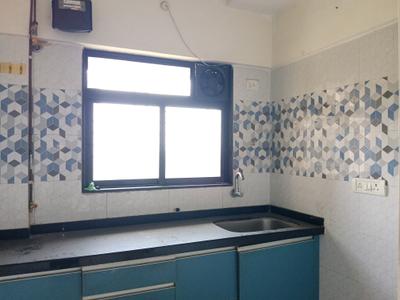 Kitchen Image of 650 Sq.ft 1 BHK Apartment / Flat for sale in Raunak Unnathi Woods Phase 3, Kasarvadavali Thane for Rs. 6300000