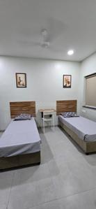 Bedroom Image of Garuda boys hostel Erandwne nalstop metro station near sndt college karve road in Kothrud, Pune