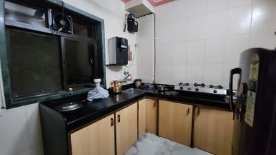 Kitchen Image of 555 Sq.ft 1 BHK Apartment / Flat for rent in Implosion CHS, Chedda Nagar Mumbai for Rs. 39000