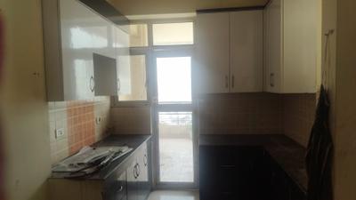 Kitchen Image of 1250 Sq.ft 2 BHK Apartment / Flat for rent in Ajnara Gen X, Crossings Republik Ghaziabad for Rs. 18000