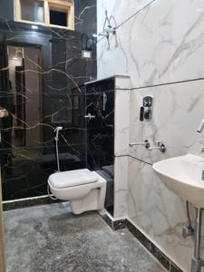 Common Bathroom Image of 600 Sq.ft 2 BHK Apartment / Flat for sale in Dwarka Mor New Delhi for Rs. 3700000
