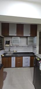 Kitchen Image of 1000 Sq.ft 2 BHK Apartment / Flat for rent in Aroma Tirupati Aakruti Greenz, Chharodi Ahmedabad for Rs. 25000