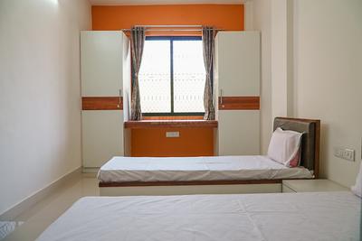 Bedroom Image of Radhesh PG for Boys in Satellite, Ahmedabad
