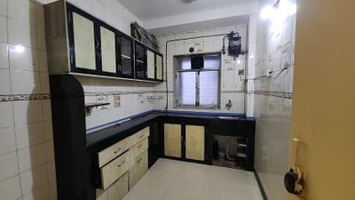 Kitchen Image of 750 Sq.ft 2 BHK Apartment / Flat for rent in Implosion CHS, Chedda Nagar Mumbai for Rs. 50000