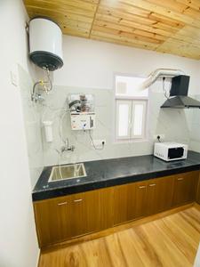 Kitchen Image of Urbanroomz Coliving PG in Sector 30, Gurgaon